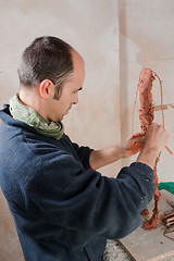 Image showing Artist modeling clay