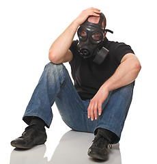 Image showing stressed man with gas mask