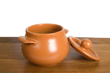 Image showing Ceramic pot on the wooden board