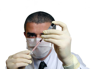 Image showing Doc filling a syringe