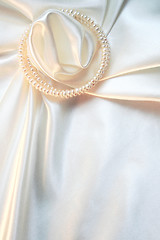 Image showing Smooth elegant white silk with pearls as wedding background 