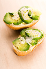Image showing Sandwich with avocado on a wooden board 