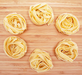 Image showing Tagliatelle on the wooden background