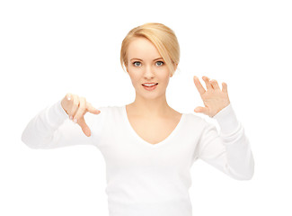 Image showing businesswoman working with something imaginary