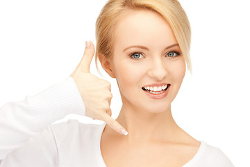 Image showing woman making a call me gesture