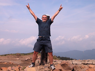 Image showing Happy man in the mountain top