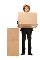 Image showing attractive businessman with big boxes