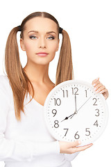 Image showing woman holding big clock