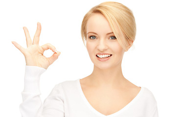 Image showing lovely teenage girl showing ok sign