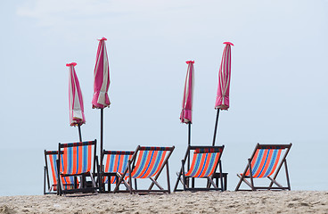 Image showing Beach chairs and parasols
