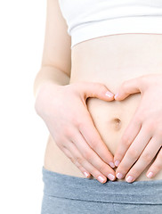 Image showing Heart shaped hands on tummy