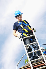 Image showing Man working on roof