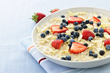 Image showing Oatmeal breakfast cereal with berries