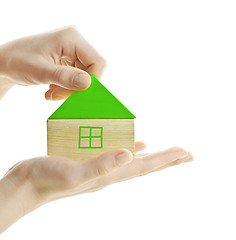 Image showing Green wooden block house