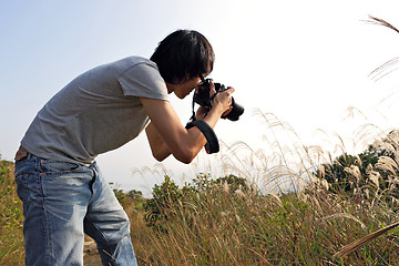 Image showing Photographer taking photo