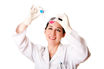 Image showing Female scientist looking at tissue culture flask