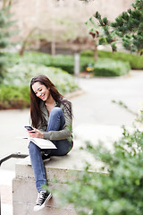 Image showing Ethnic student texting