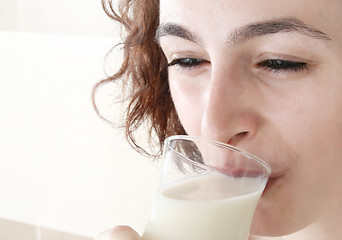 Image showing Young people eating milk with cereals