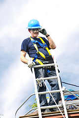 Image showing Man working on roof