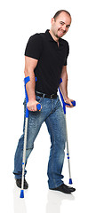 Image showing man with crutch