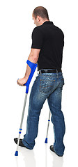 Image showing man with crutch