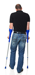 Image showing man with crutch