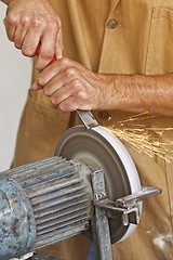 Image showing handyman work at grindstone
