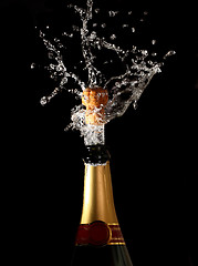 Image showing champagne bottle with shotting cork