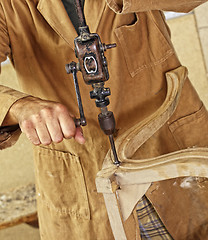 Image showing carpenter with hand drill