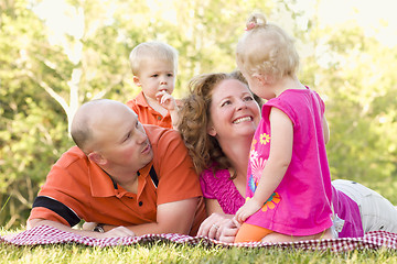 Image showing Happy Young Family with Cute Twins in Park