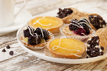 Image showing fruit mini tarts and coffee