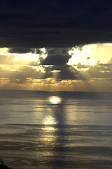 Image showing dramatic spring sunset with storm front