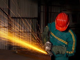 Image showing heavy industry manual worker with grinder 03