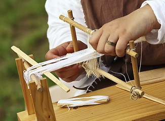 Image showing loom and hands