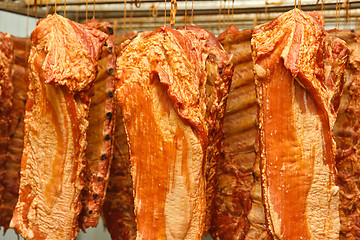 Image showing Hanging smoked pork ribs