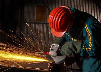 Image showing heavy industry manual worker with grinder 02