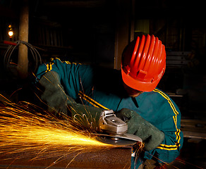 Image showing heavy industry manual worker with grinder 01