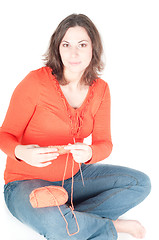 Image showing Portrait of pretty pregnant woman knitting