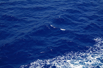 Image showing Dark blue sea water surface with ripple as background 