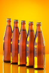Image showing Row of bottles with beer