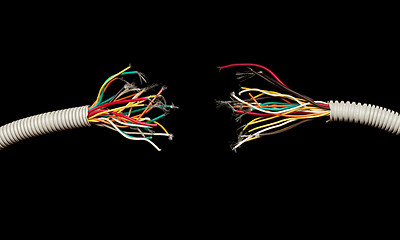 Image showing torn apart wires isolated on black