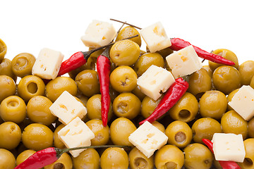 Image showing Pile of olives and chili pepper and sheep cheese