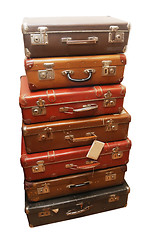 Image showing Pile of battered old suitcases