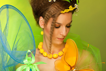 Image showing Summer girl catching butterfly with butterfly net