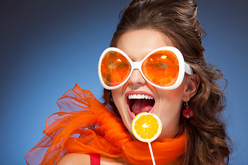 Image showing Woman with citrus lollipop