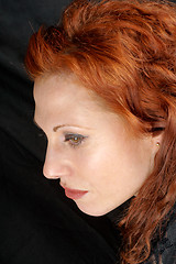 Image showing Red hair woman side-face