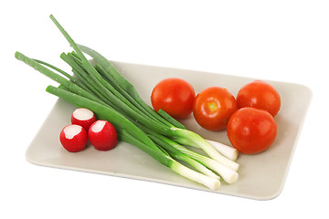 Image showing white plate with tomato, radish and green onion