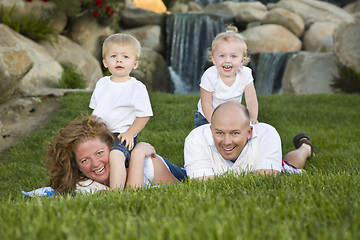 Image showing Happy Young Family with Twins Portrait in Park