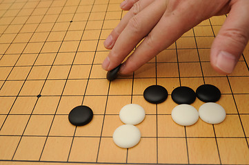 Image showing Playing go game