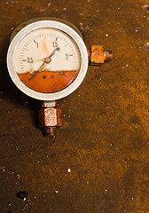 Image showing Gas meter against rusty background